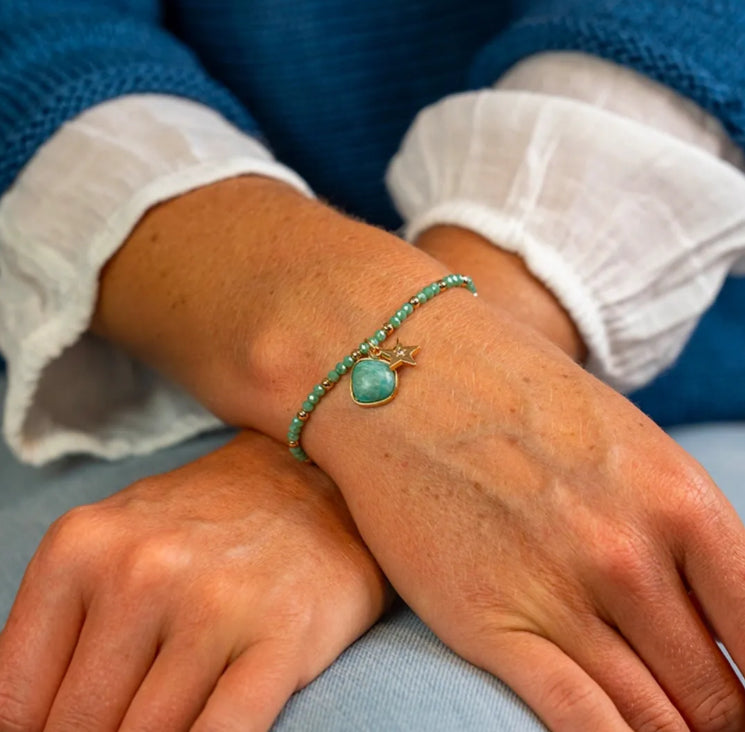 Sea green and golden charm bracelet with star and stone