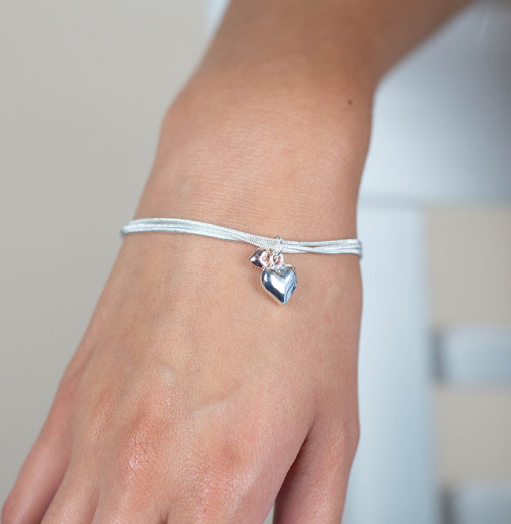 Triple silver chain bracelet with double heart