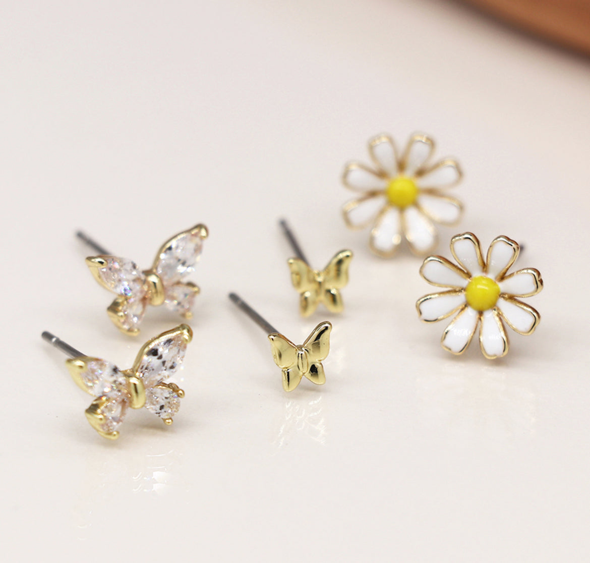 Golden triple flower and butterfly stud set