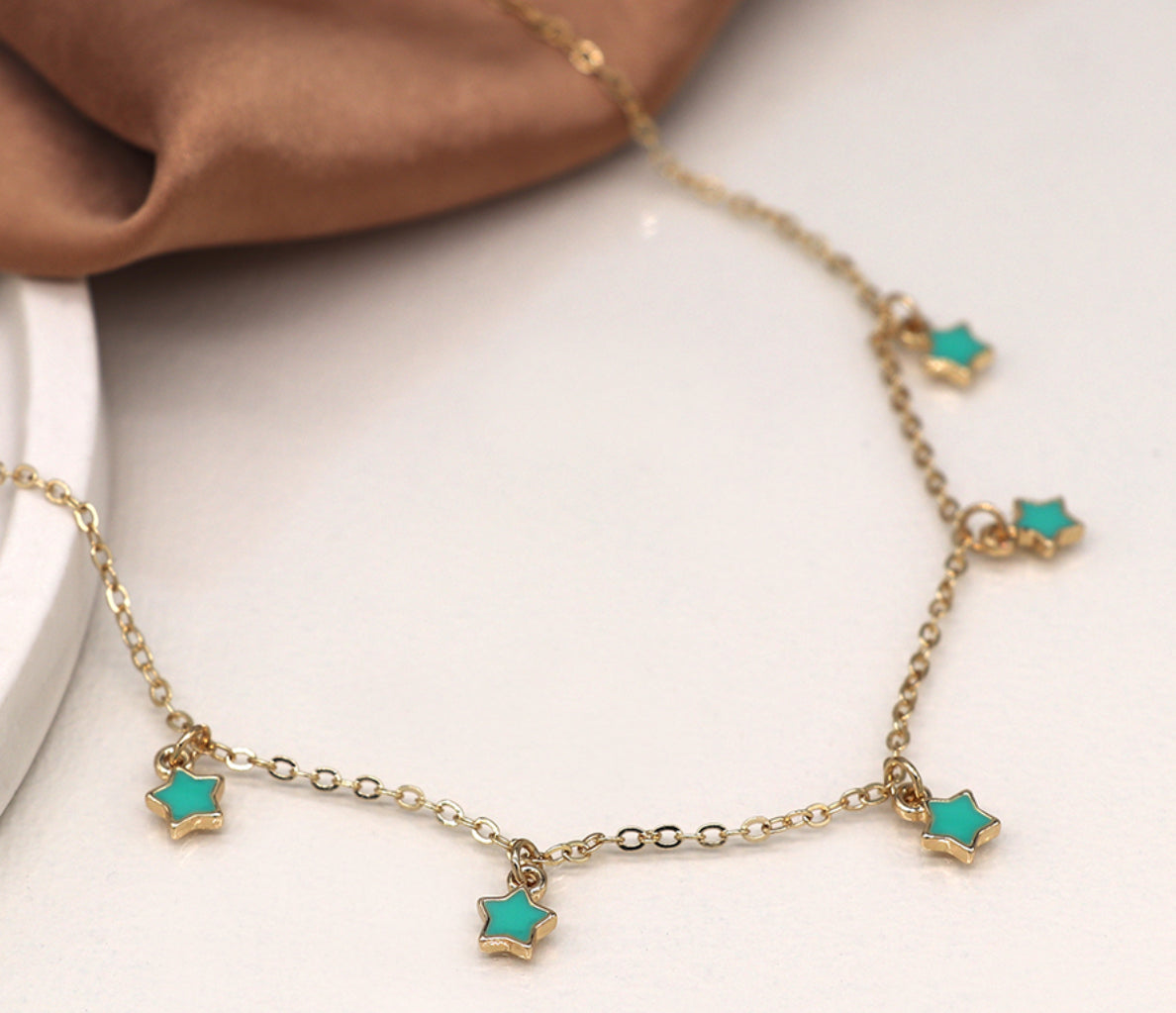 Golden chain and turquoise stars necklace