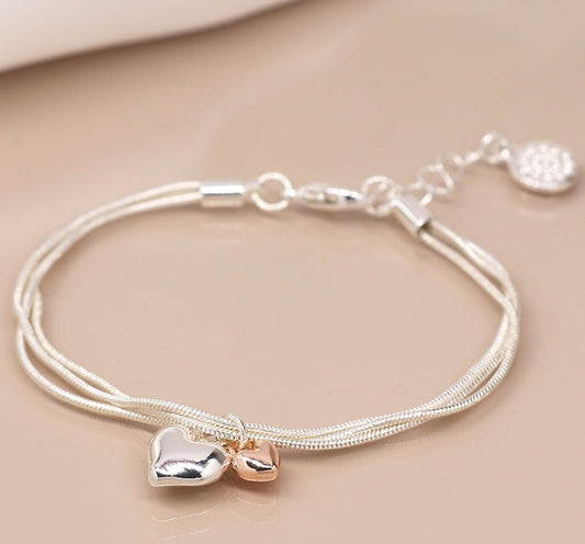 Triple silver chain bracelet with double heart