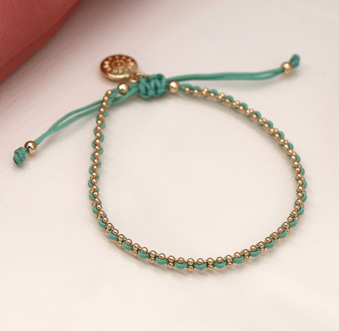 Gold bead chain and aqua cord bracelet