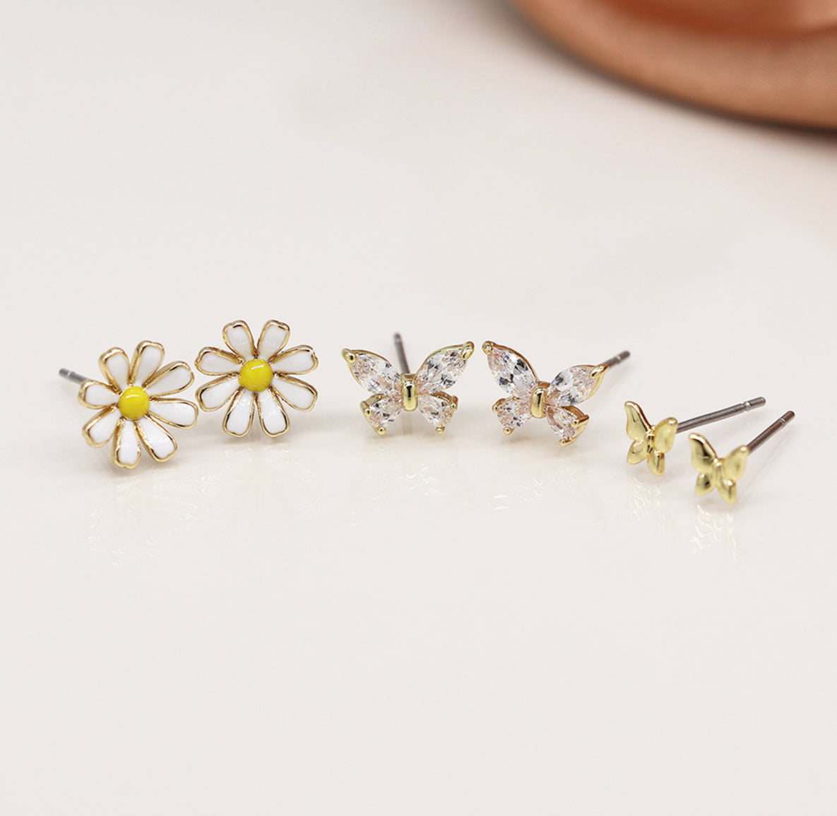 Golden triple flower and butterfly stud set