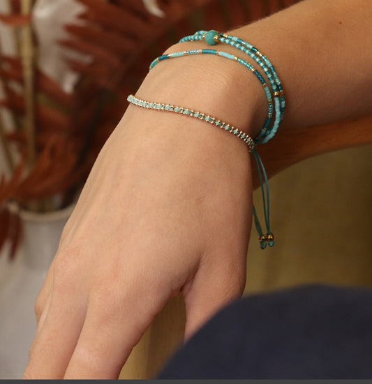 Gold bead chain and aqua cord bracelet