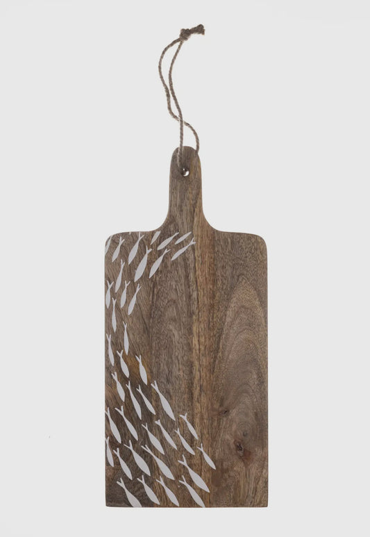 A Light Mangowood Chopping board with a shoal of small fish etched across one half and shoal painted white. 