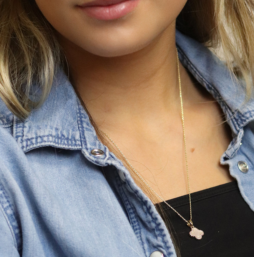 Golden crystal edged quatrefoil necklace